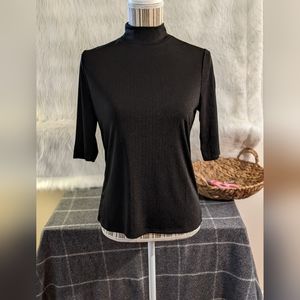 Cyrus Black ribbed polyester mock turtleneck, half sleeve.